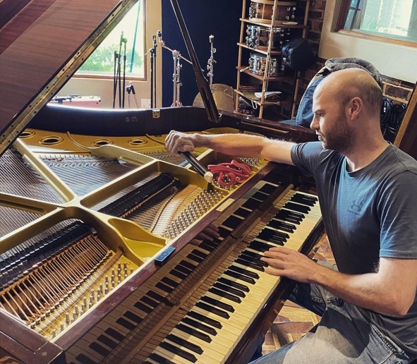 Rudi Strydom carrying out on-site piano servicing in Gauteng